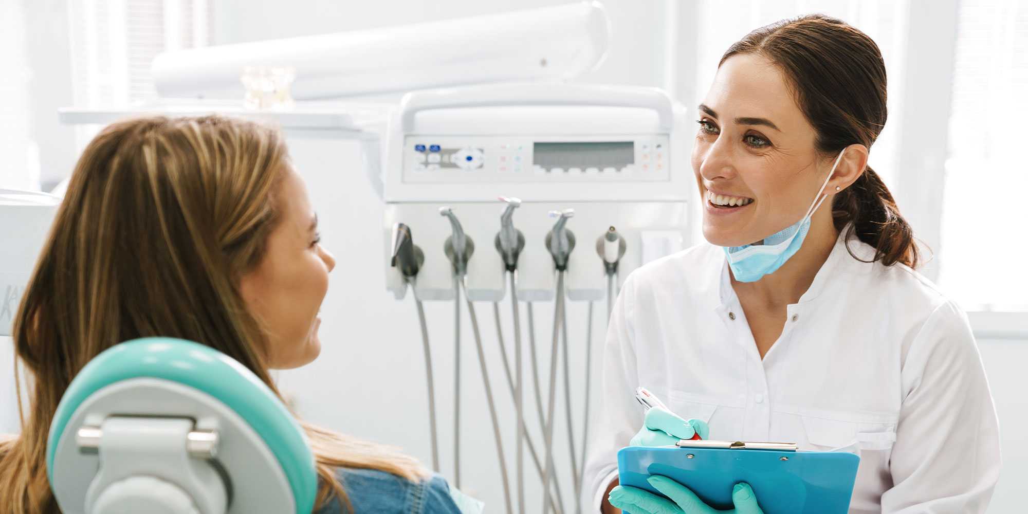 dr with clipboard goes over procedure